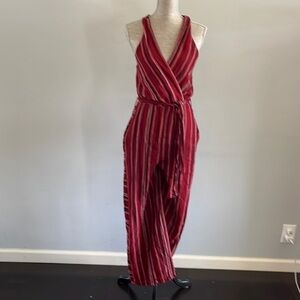 Indigo Rein size Med jumpsuit halter top w\ criss cross in front and waist belt.